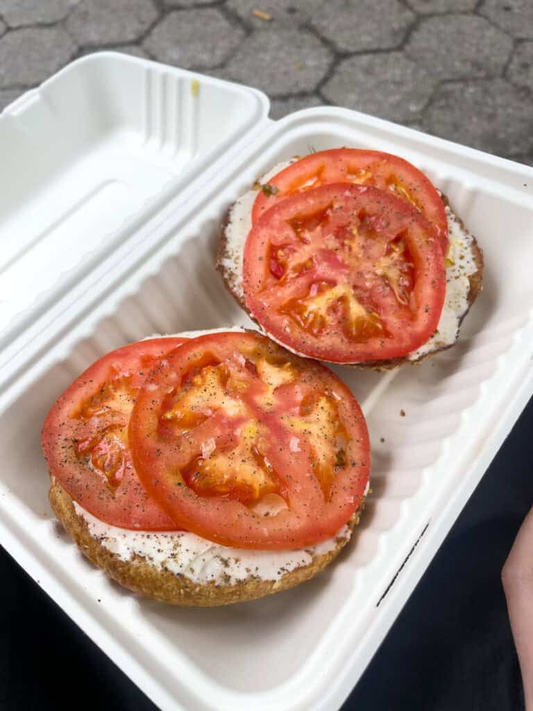 bagel with cream cheese and tomato from apollo bagels nyc